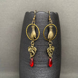 Mio Queena Dragon & Hand Dangle Earrings