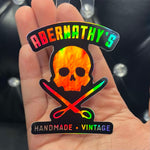 Abernathy's Holographic Skull and Scissors Sticker