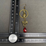 Mio Queena Dragon & Hand Dangle Earrings