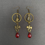 Mio Queena Dragon & Hand Dangle Earrings