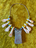 Unforgiven Cow Teeth Tiki Pendant Necklace in teal
