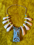 Unforgiven Cow Teeth Tiki Pendant Necklace in teal
