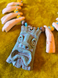 Unforgiven Cow Teeth Tiki Pendant Necklace in teal