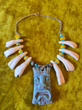 Unforgiven Cow Teeth Tiki Pendant Necklace in teal