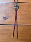Unforgiven Ornate Gold Red & Black Leather Bolo Tie