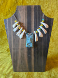 Unforgiven Cow Teeth Tiki Pendant Necklace in teal
